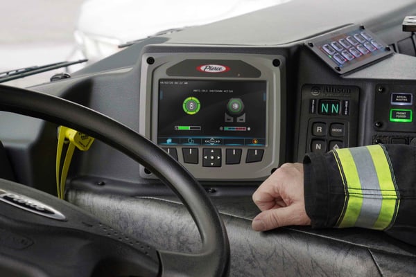 Interior driver’s side of a Pierce Fire Truck with a Command Zone touchscreen system. 