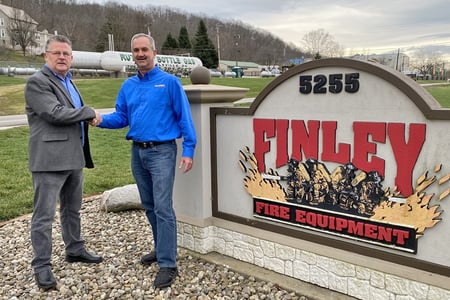 Joe Pack of Atlantic Emergency Solutions and John Finley of Finley Fire Equipment shake hands