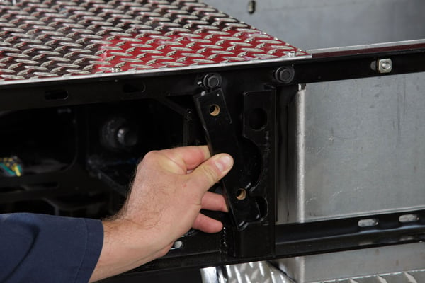 A certified technician servicing a part on a Pierce apparatus. 