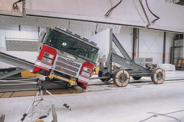 Side Roll Crash Testing for a Pierce Fire Truck Chassis inside of a warehouse. 