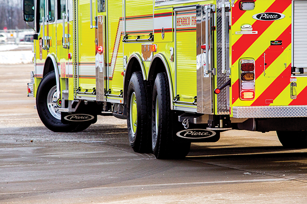 TAK-4 Independent Suspension System on a Pierce Fire Truck parked outside in a parking lot. 