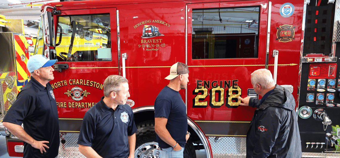 Four menu looking at a red fire truck that reads "Engine 208"