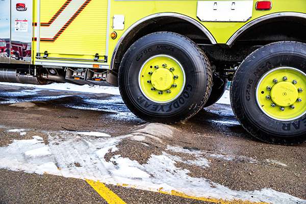 Pierce Fire Truck parked outside in a parking lot on a snowy day testing the TAK-4® Suspension System. 