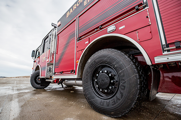Pierce Fire Truck parked outside in a parking lot with a TAK-4® IRS Reduced Road Input. 