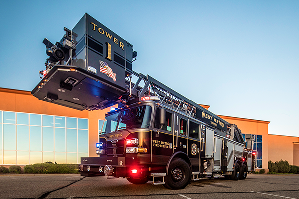 Pierce Fire Truck parked outside near a building with a TAK-4® Independent Front Suspension Drivers Side. 