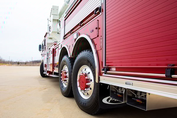 A close up of the rear tires turning on a Pierce Ascendant 100 Aerial Tower with Tak4 T3 Rear Suspension.