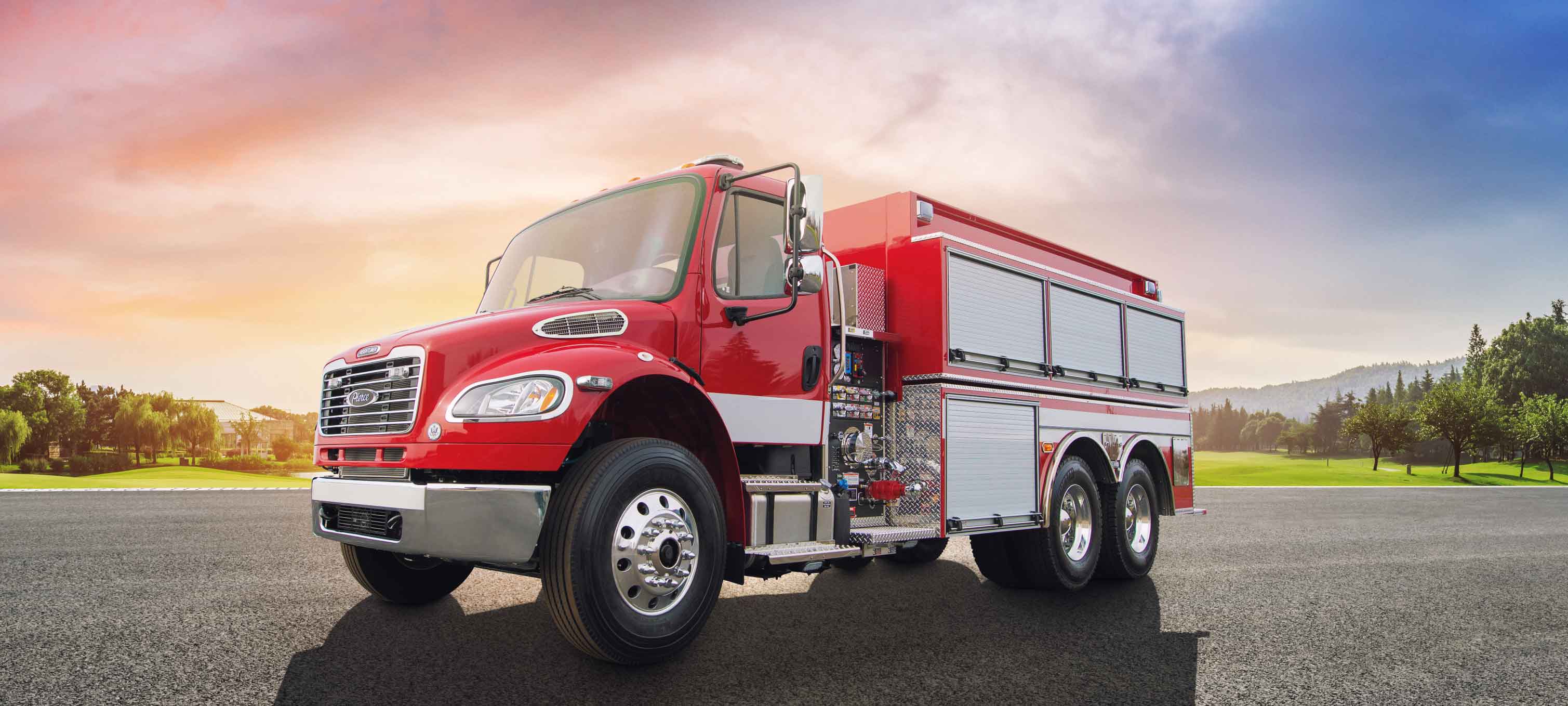 Front and Driver’s side of a Pierce BX Tanker parked outside in a parking lot. 