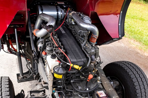 The cab of a fire truck tilted up showing a PACCAR engine.