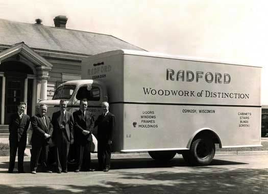 Five Pierce employees standing outside in front of a Radford Woodwork truck in 1948. 