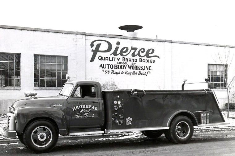 Darley Mid-Ship Pump parked outside of the Pierce Manufacturing building in 1956.
