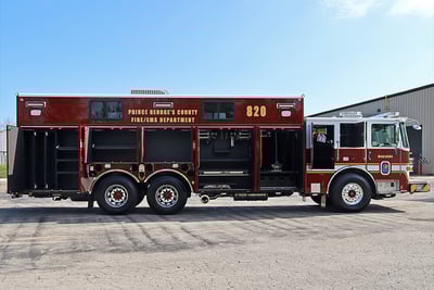 A red and white heavy-duty walk-in rescue fire apparatus side profile image shows all compartments open. 