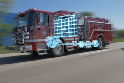 A red electric fire truck with an overlay highlighting the parallel electric drivetrain, internal combustion engine, and battery placement.
