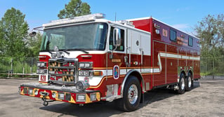 Prince George's County Fire/EMS Department's dark red Pierce heavy rescue truck, unit 820, parked outside.