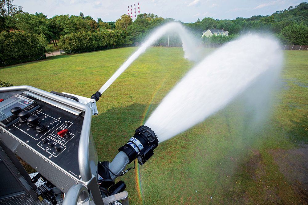 Ascendant 100' Heavy-Duty Aerial Tower Platform Spraying Water