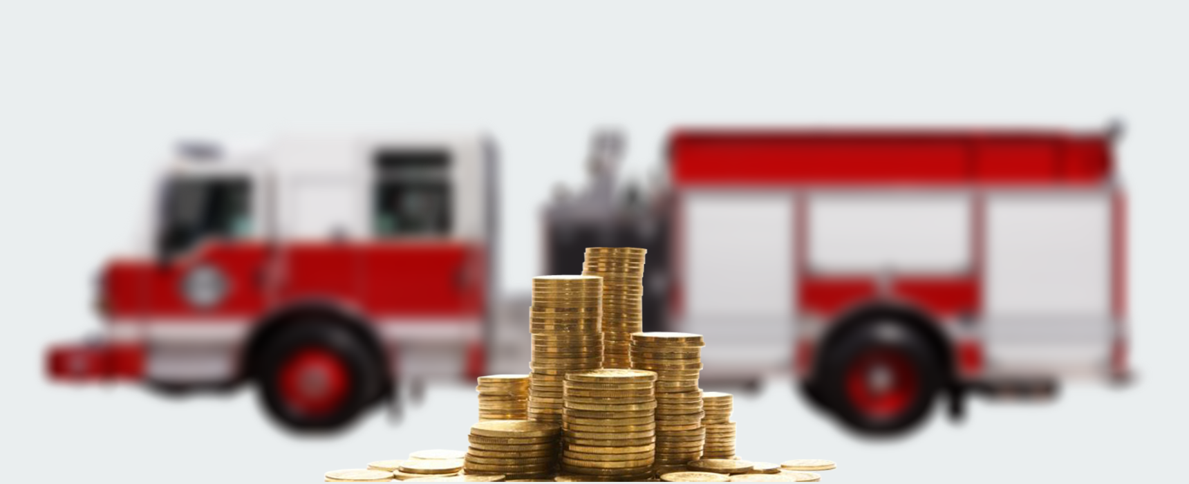 Focussed , close up image of coins with a blurred background of a Pierce firetruck available for leasing purchase programs.