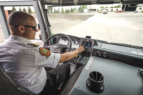 Fire Chief from Winnipeg Fire Department driving fire truck