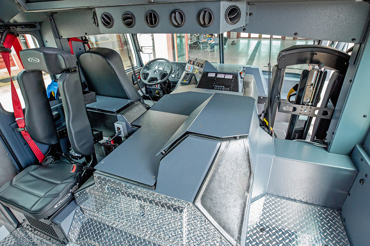 Interior crew cab seating of pumper fire truck