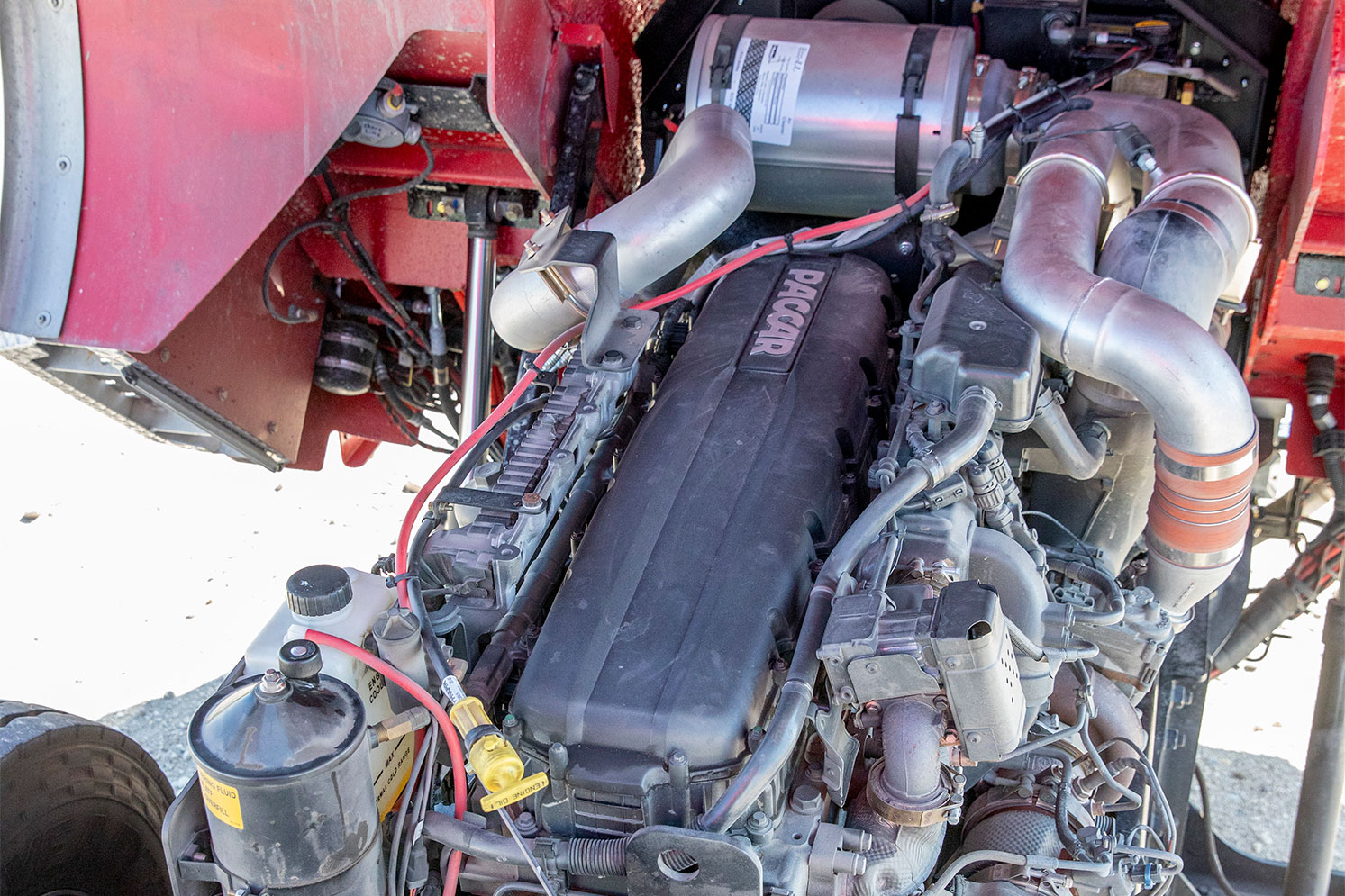 A PACCAR MX13 engine installed on a Pierce fire truck as the cab is tilted.
