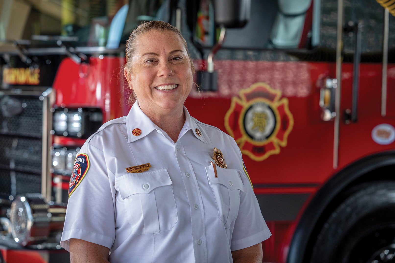 The fire chief of Ferndale Fire Department in Michigan posed in front of a fire truck.