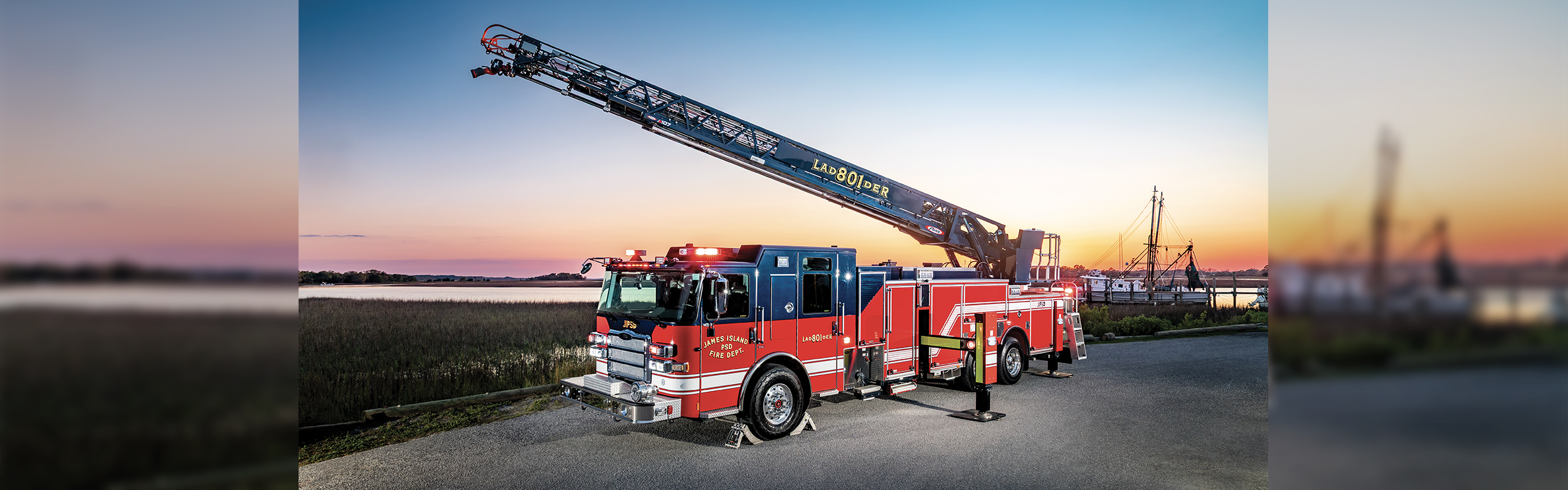 The front driver's side of an Enforcer PUC 107 Ascendant Aerial Ladder parked in front of the ocean and a sunrise with