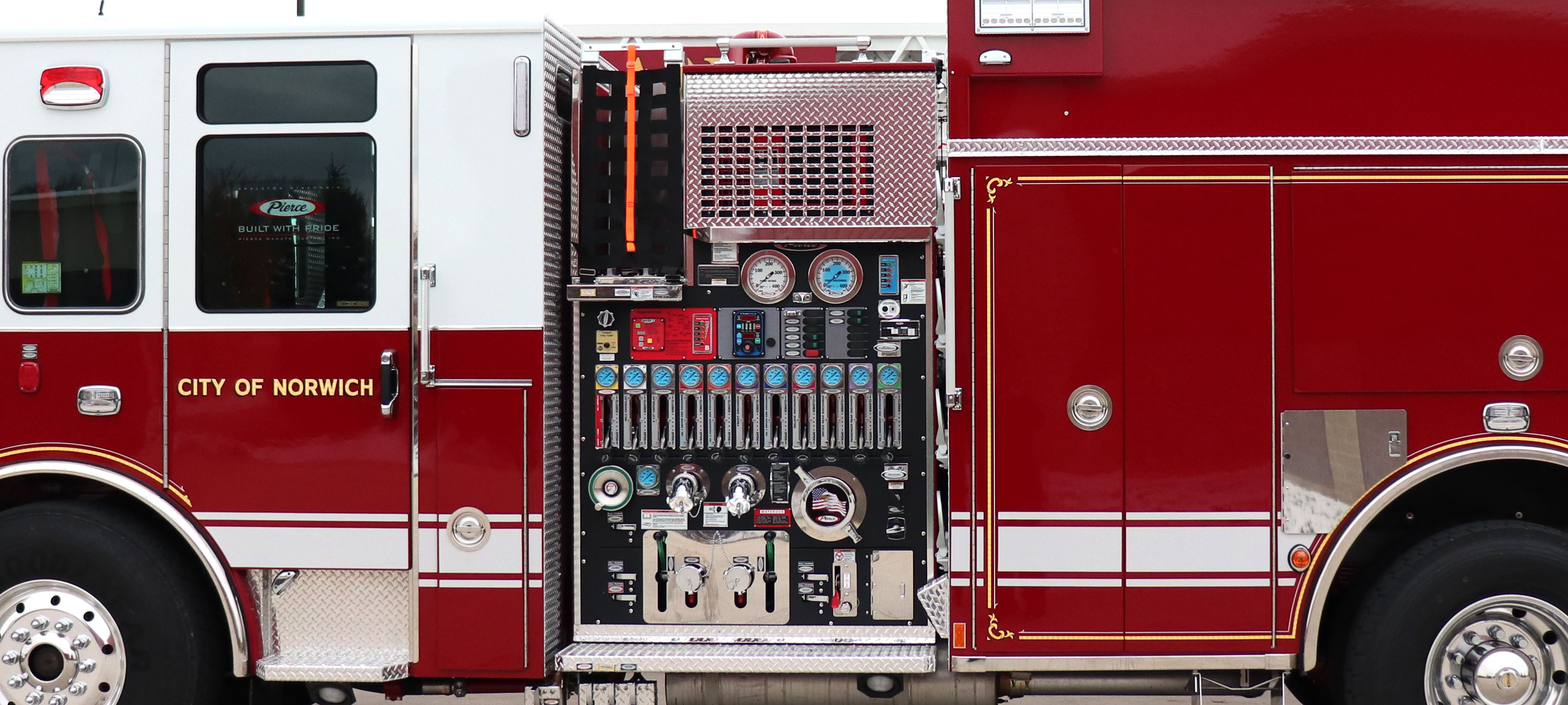 Pump panel with Crosslays behind the cab on the driver’s side of a Pierce Fire Truck. 