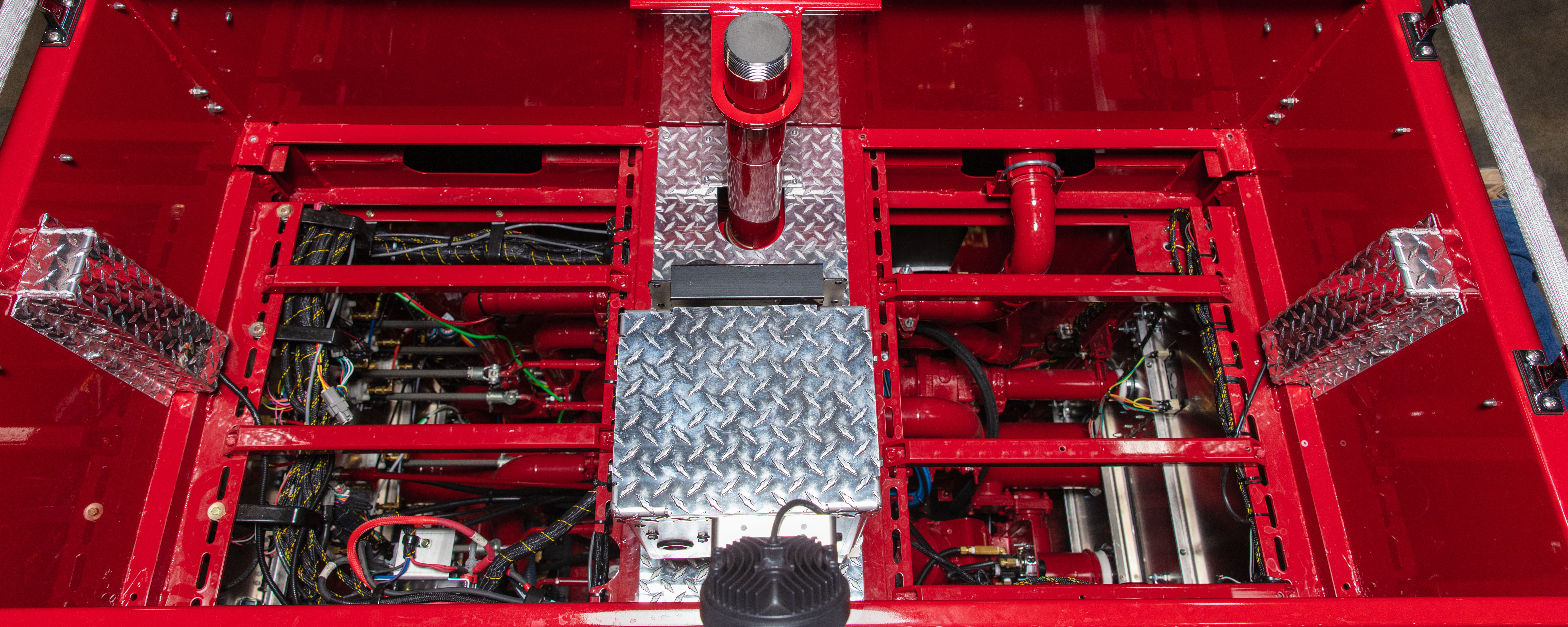 Aerial view of a pump panel on a Pierce Fire Truck. 