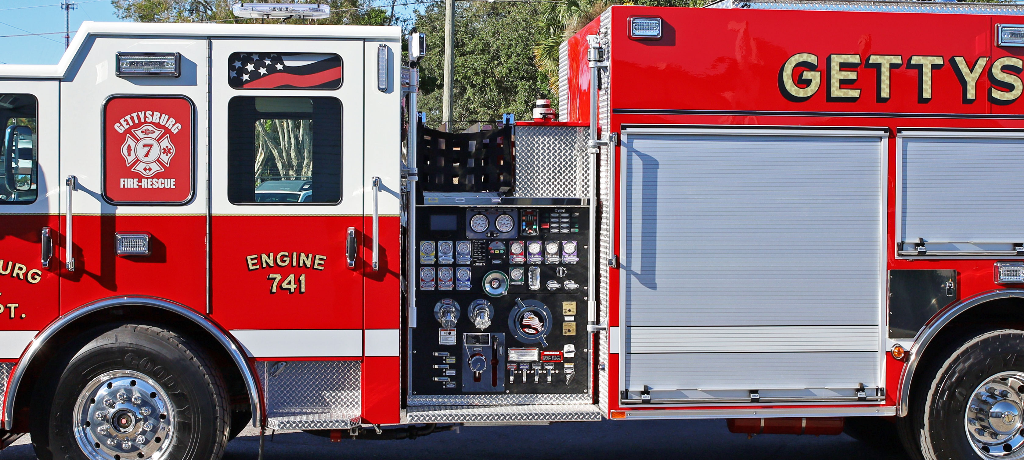 Pump panel with Crosslays behind the cab on the driver’s side of a Pierce Fire Truck. 