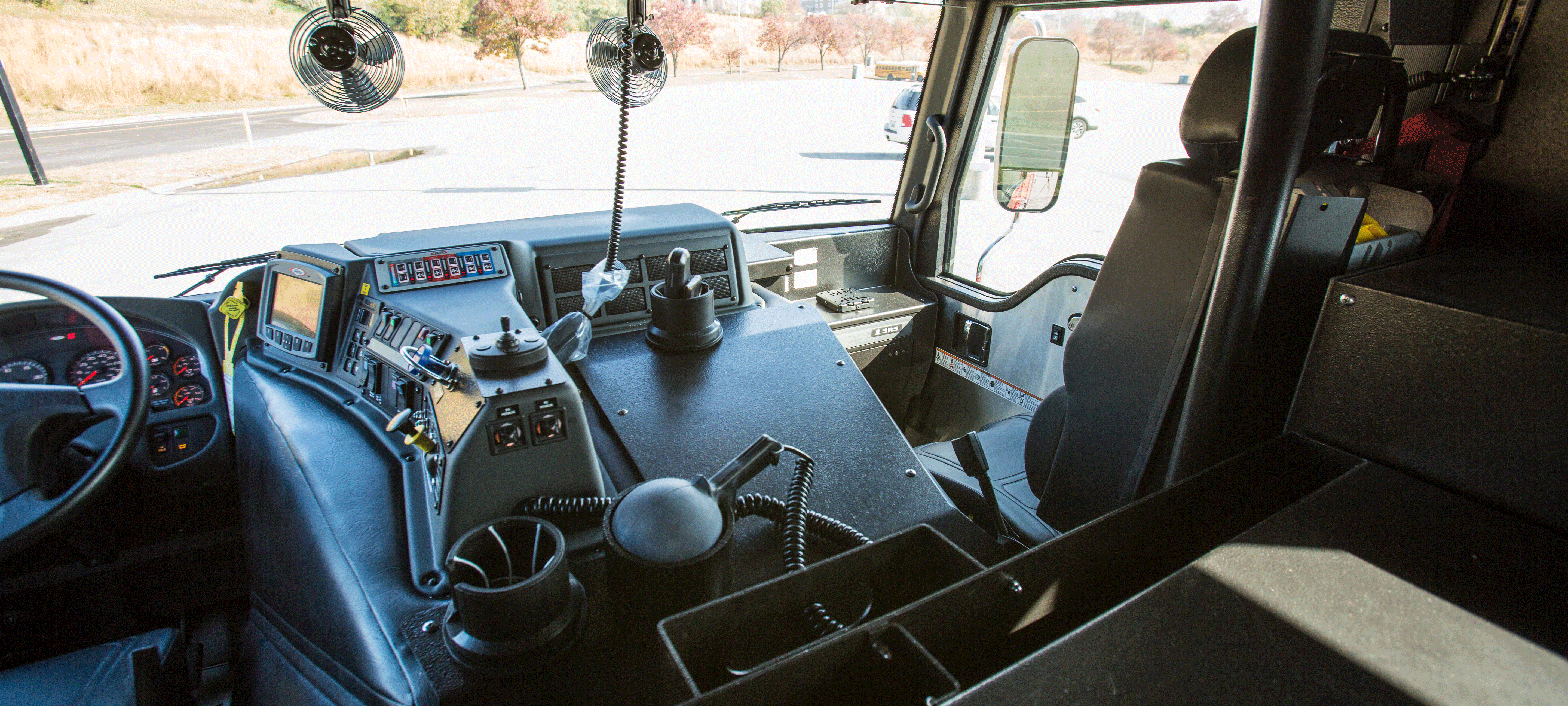 Pierce Impel custom fire truck chassis officer's side black interior. 