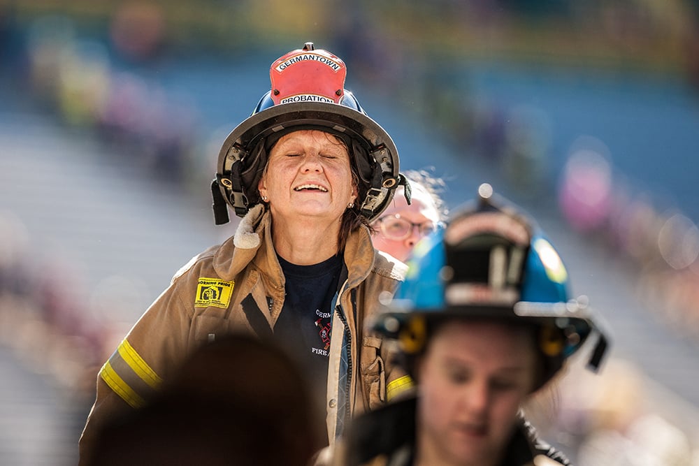 Firefighters in turnout gear climbing the stairs at Lambeau Field at the Pierce Manufacturing 9/11 Stair Climb Event.