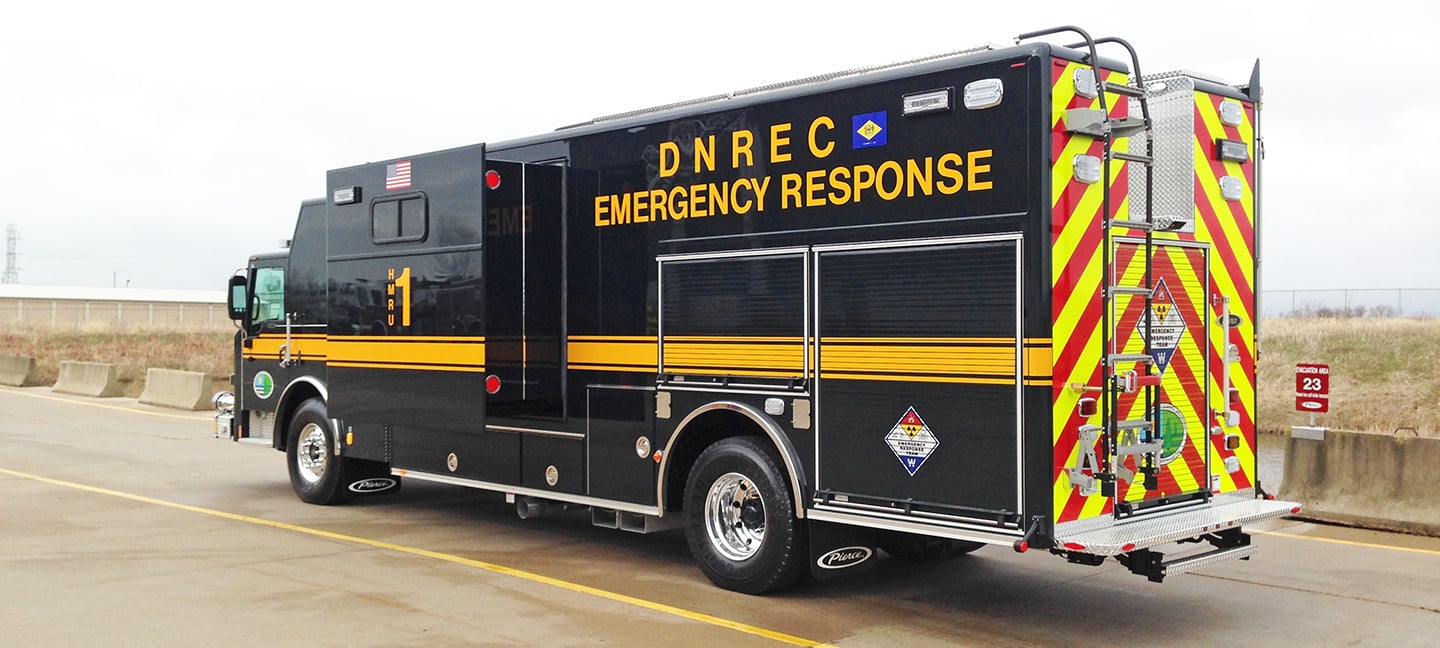 Pierce Combination Heavy-Duty Rescue Fire Truck parked outside in a parking lot on a cloudy day. 