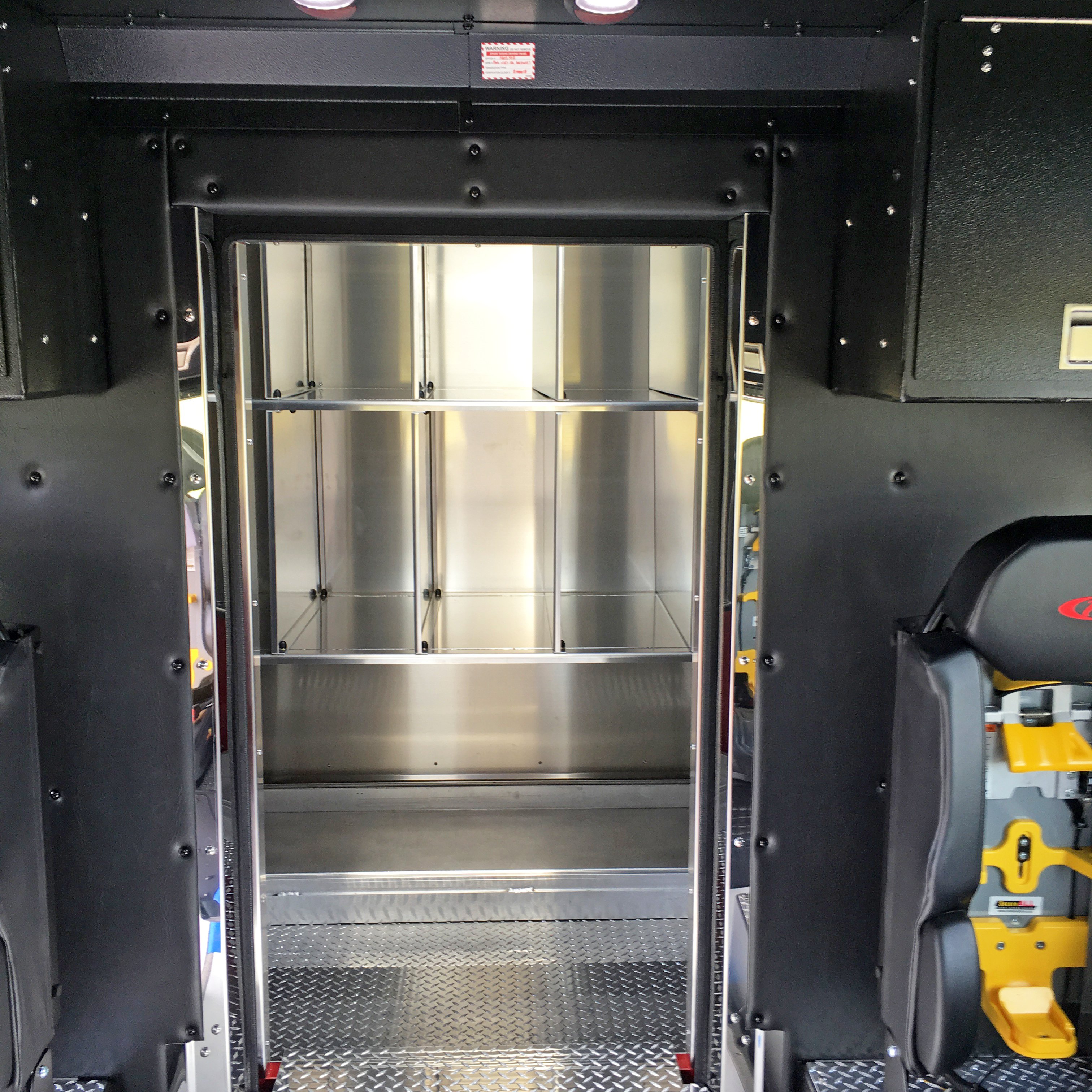 Silver Interior compartments of a Pierce Combination Rescue Fire Truck. 