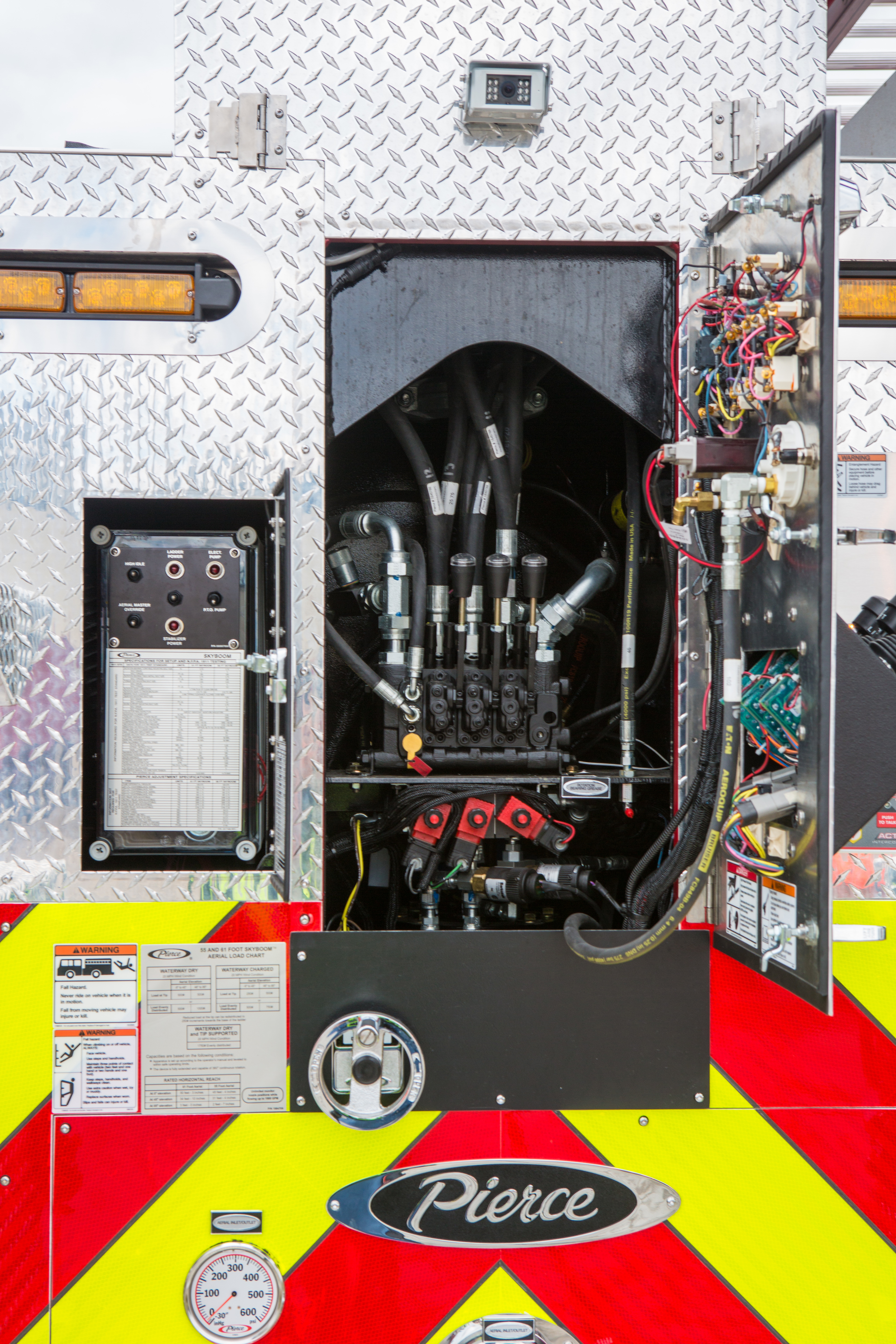 Pierce Heavy-Duty Sky-Boom Aerial Water Tower remote control door panel open for service. 