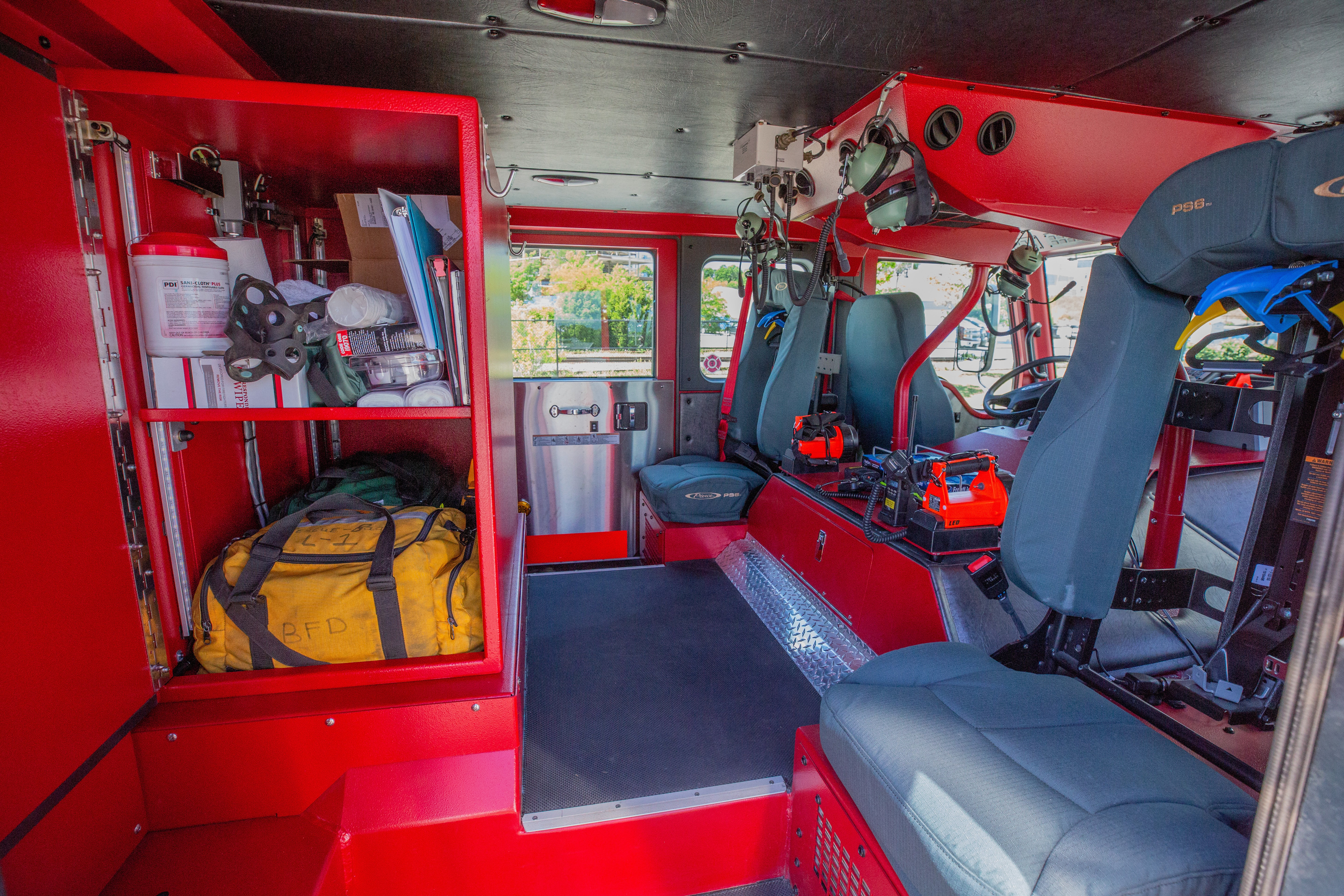 Pierce Velocity custom fire truck crew cab configuration with grey seats and a red interior. 