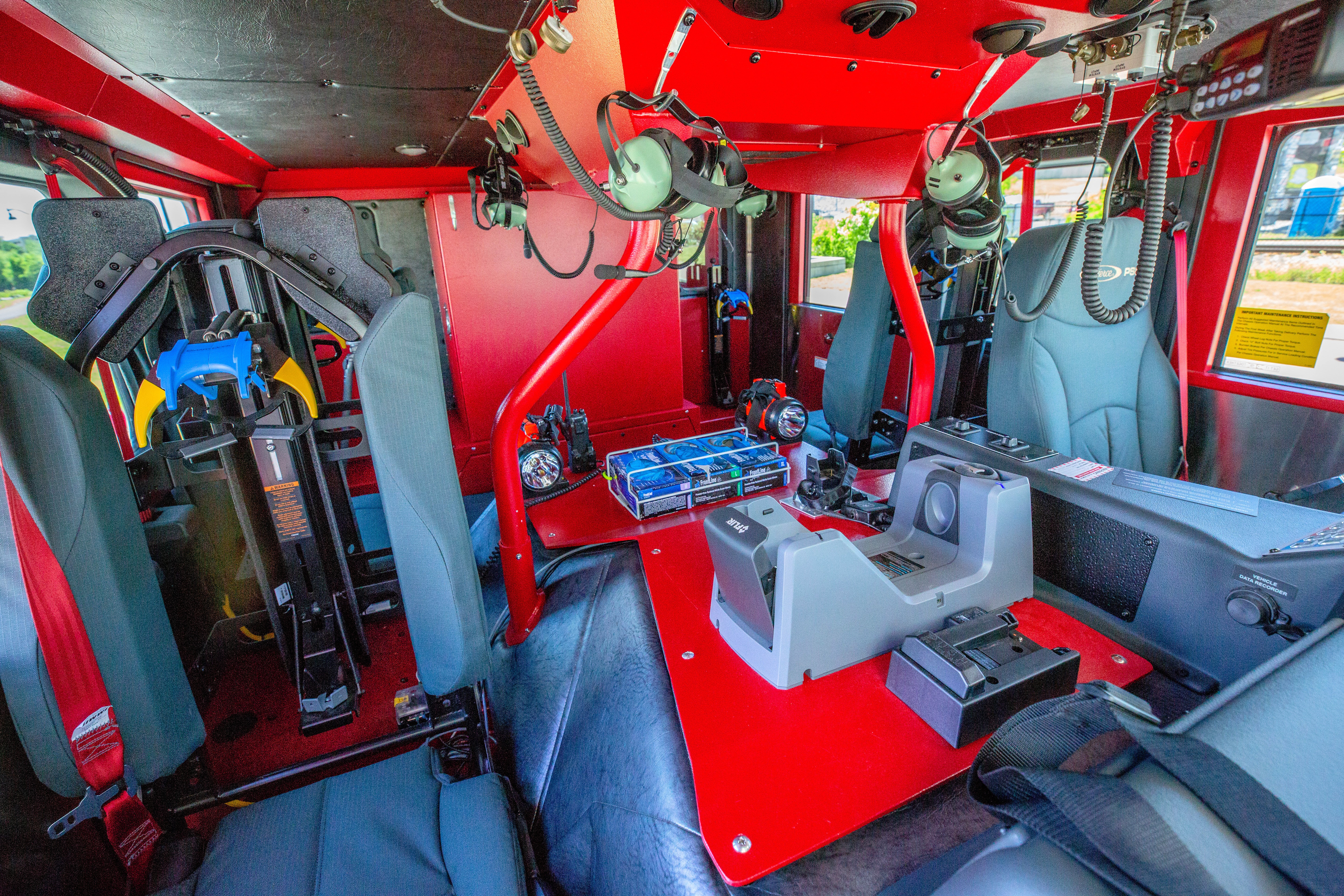 Pierce Velocity custom fire truck crew cab configuration with grey seats and a red interior. 