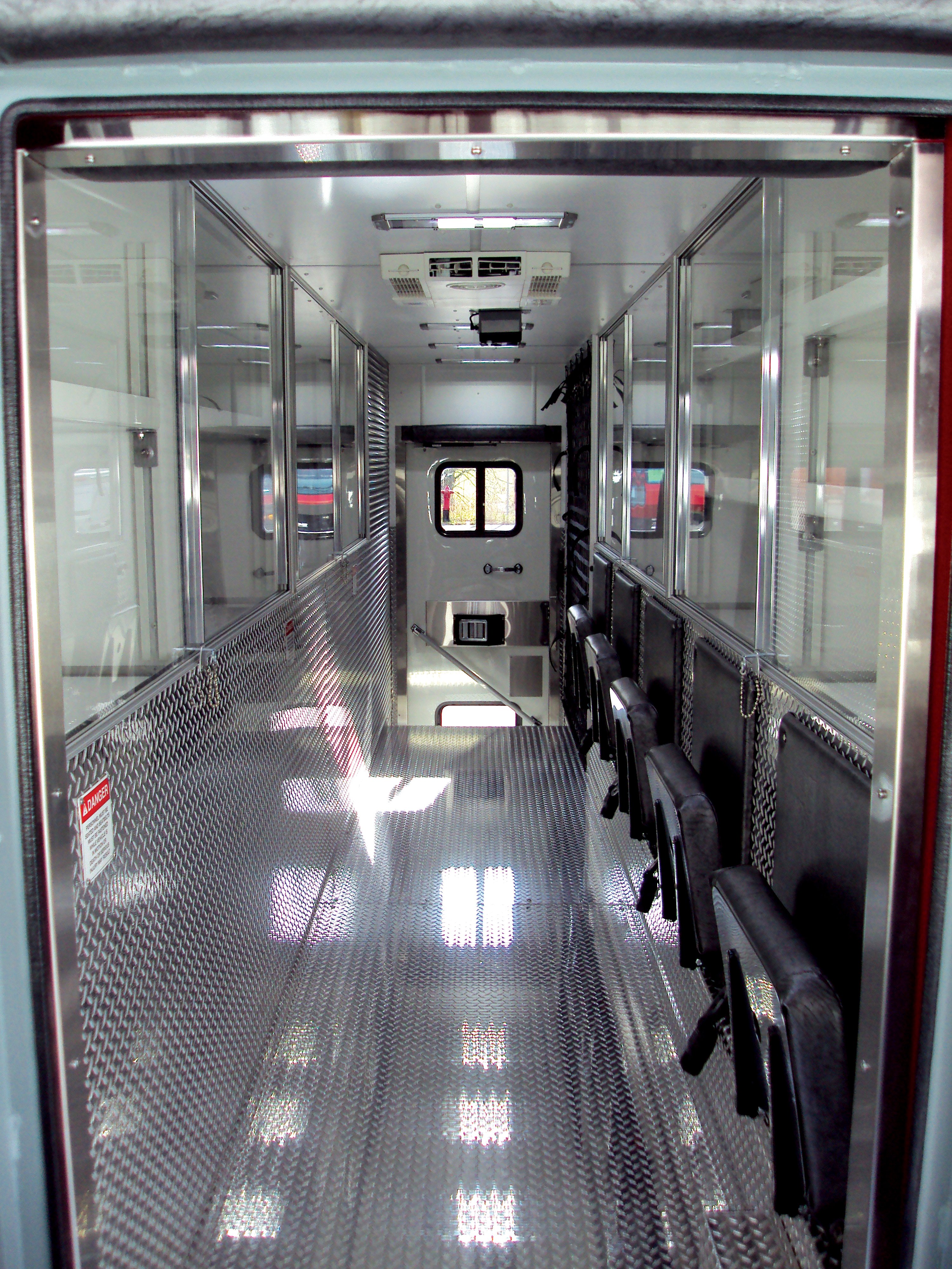 Interior walkway of a Pierce Walk-In Heavy-Duty Rescue Fire Truck. 