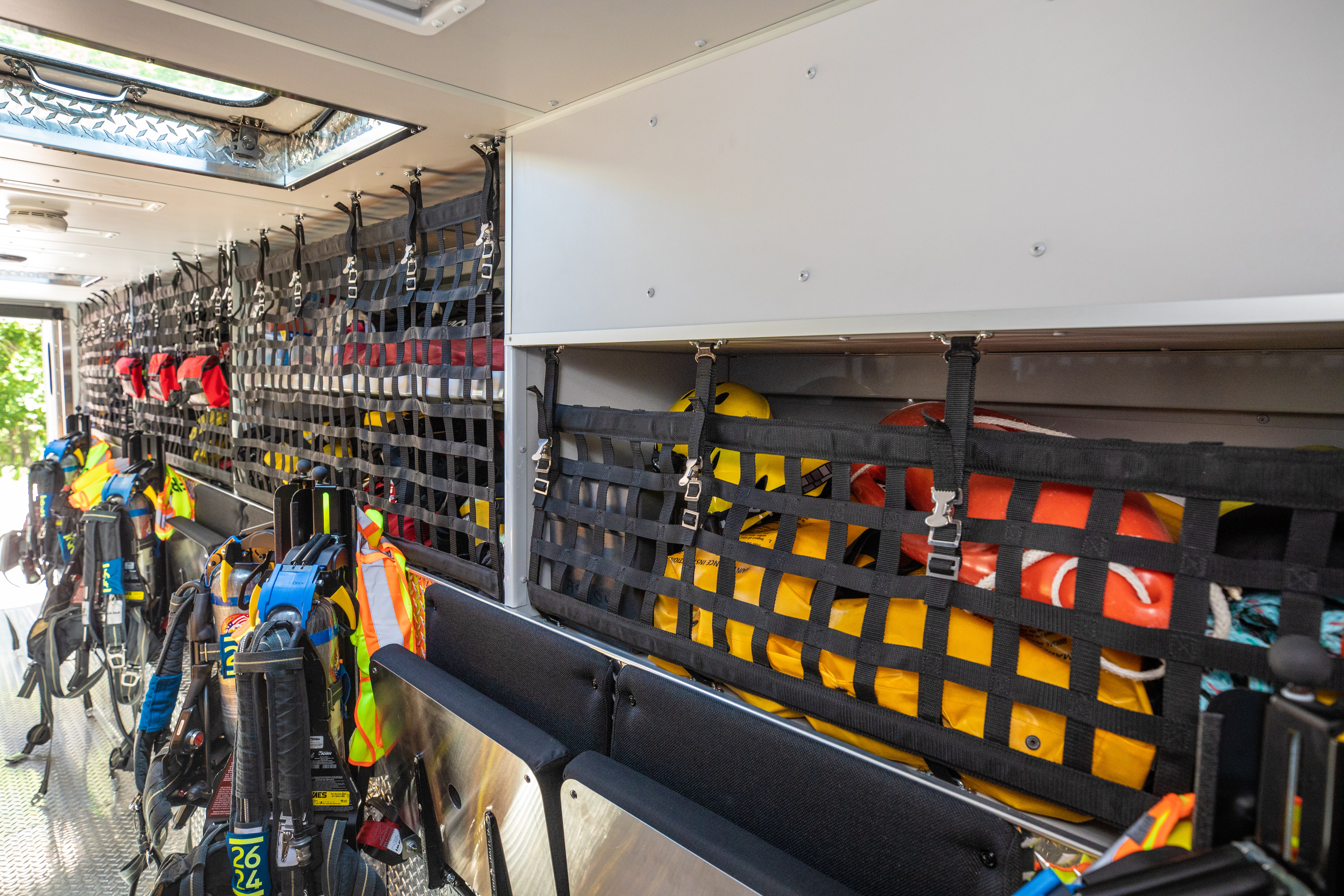 Interior storage in a Pierce Walk-In Heavy-Duty Rescue Fire Truck with firefighting gear and compartment space. 