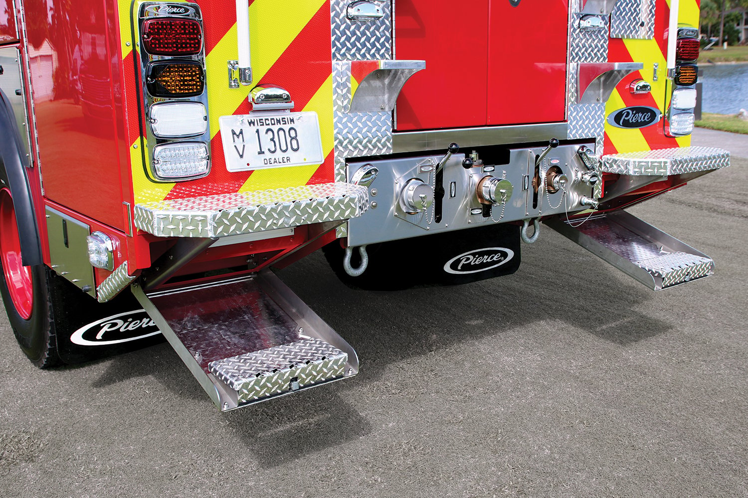 Rear of a Pierce BX™ Wildland Fire Truck with Swing Down Steps on the left and right side below the bumper. 