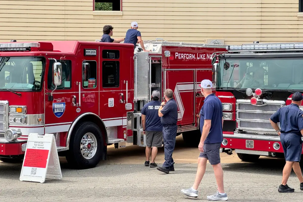 Attendees inspect a Pierce Enforcer top mount PUC pumper fire truck during the Pierce Road Rally.